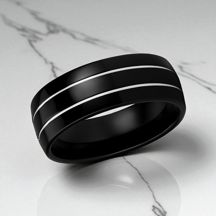 Close-up of dual offset polished grooves on black tungsten band