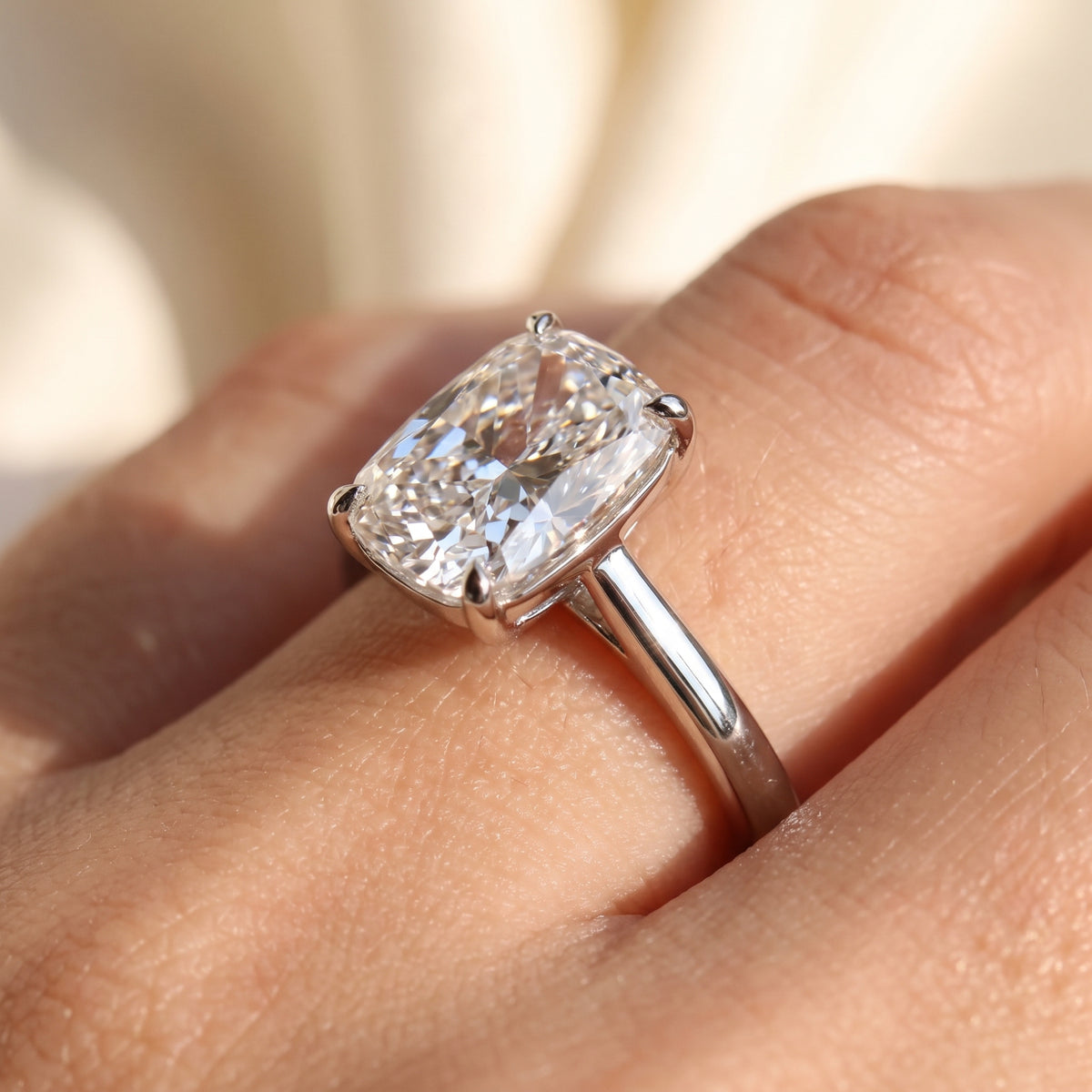 Elongated Cushion lab-grown diamond solitaire engagement ring, White Gold, on-finger close-up