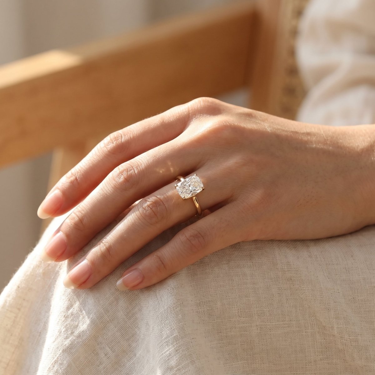 Elongated Cushion lab-grown diamond solitaire engagement ring, Yellow Gold, lifestyle photograph