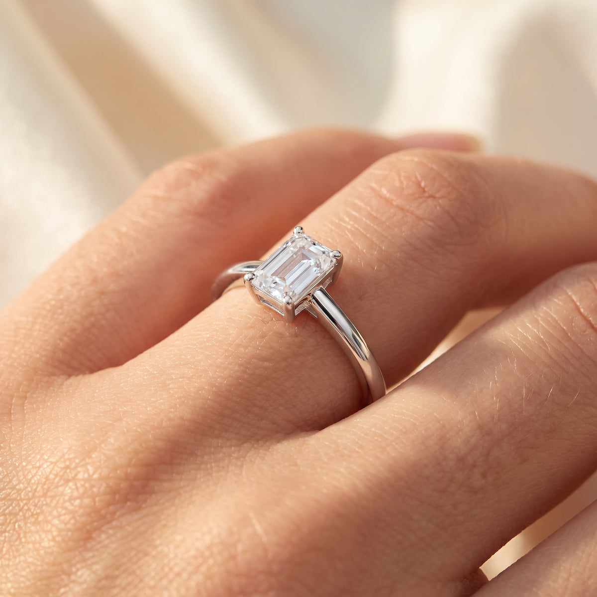 Emerald lab-grown diamond solitaire engagement ring, 925 Sterling Silver, on-finger close-up