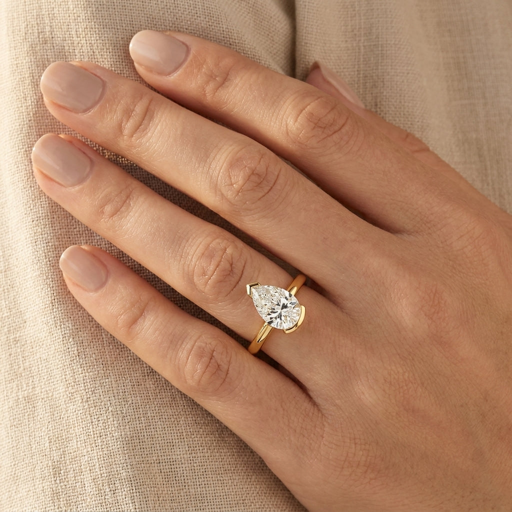 RM12974-200-LD Round solitaire engagement ring hand-model