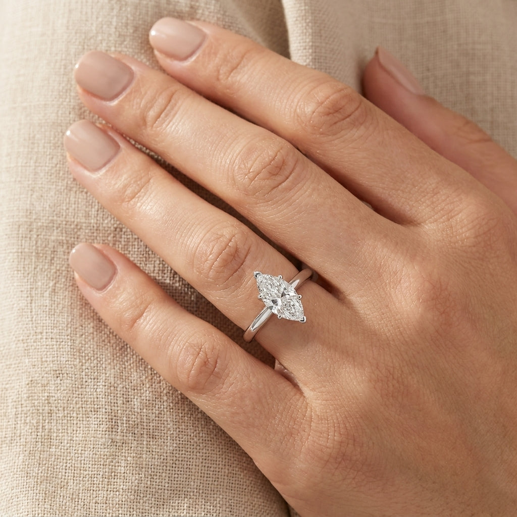 SOL-100MQ-0WLD Marquise solitaire engagement ring hand-model