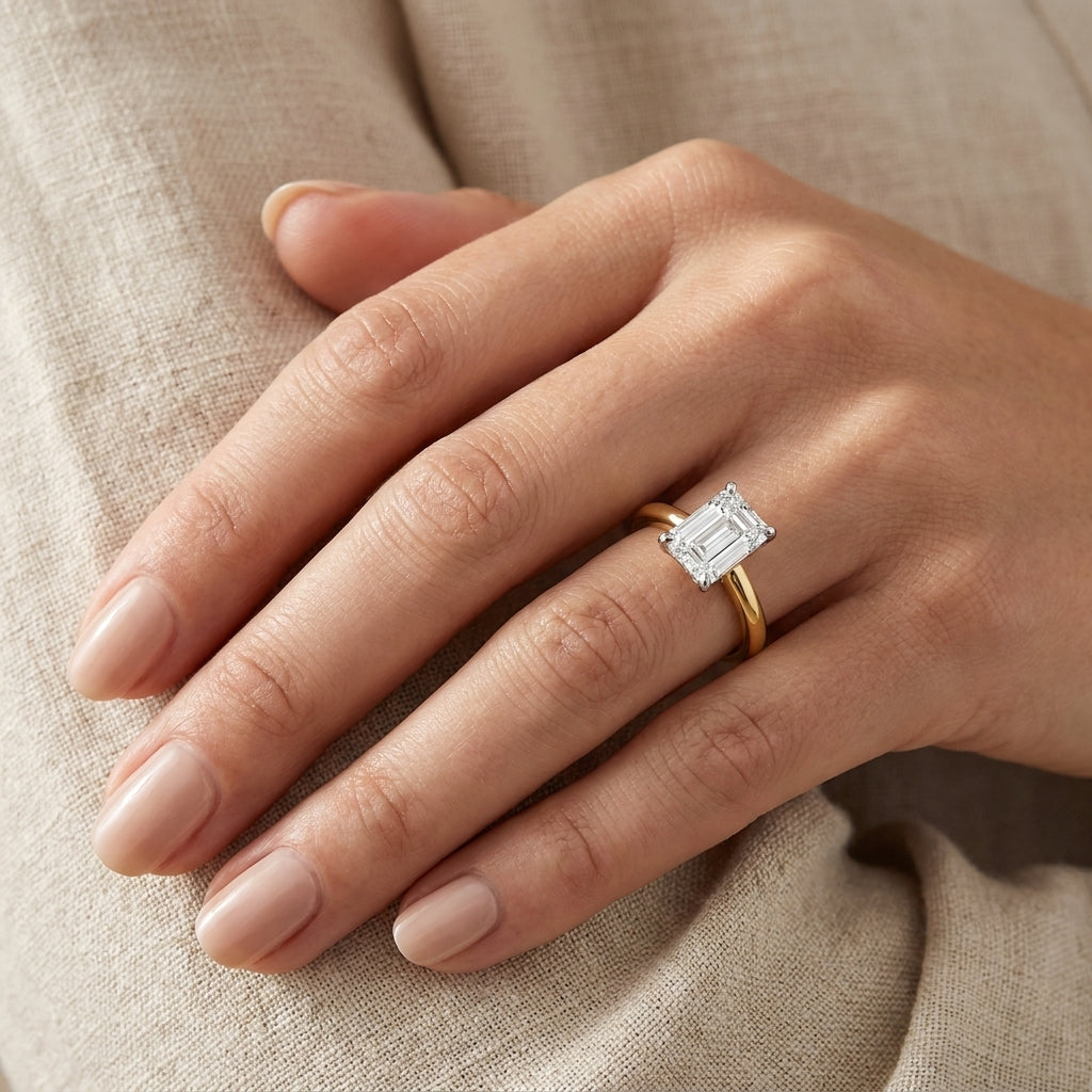 SOL-150EM-0LD Emerald solitaire engagement ring hand-model