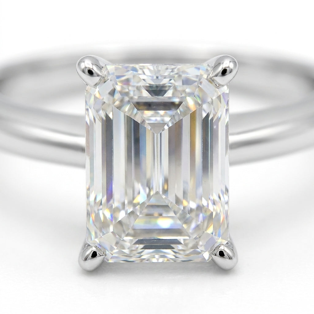 SOL-250EM-0WLD Emerald solitaire engagement ring macro-sparkle