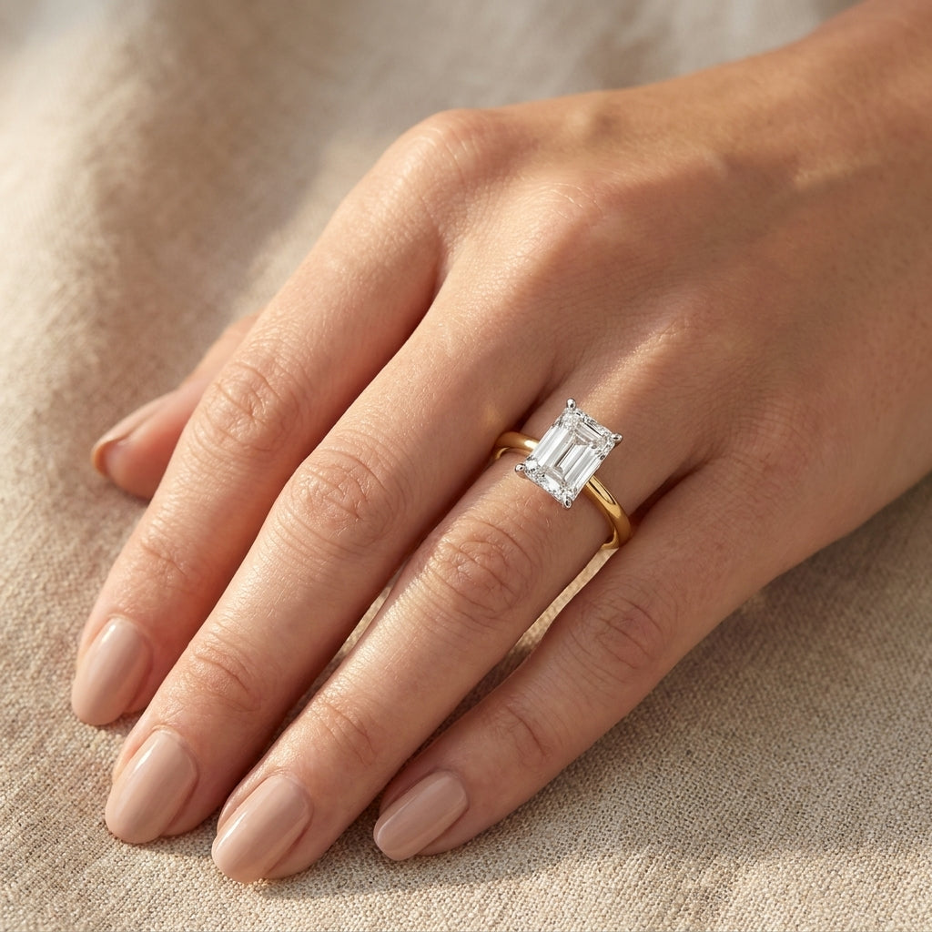 SOL-300EM-0LD Emerald solitaire engagement ring hand-model