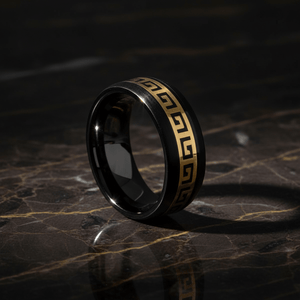ERDIL — Luxury 3/4 angle on dark marble — men's tungsten wedding ring.