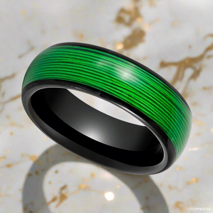 Side profile of EVERGREEN Black Tungsten Ring showcasing green wire inlay