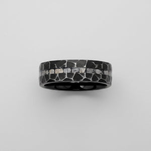 FISSURE black tungsten ring top-down view showing hammered finish and meteorite inlay