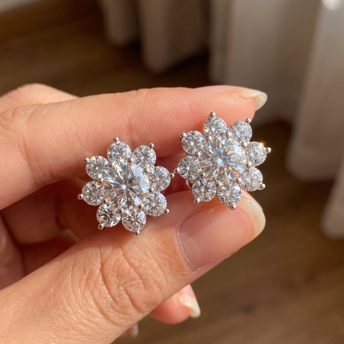 Floral Diamond Stud Earrings 925 silver lab grown diamond earrings held in hand lifestyle close-up photo