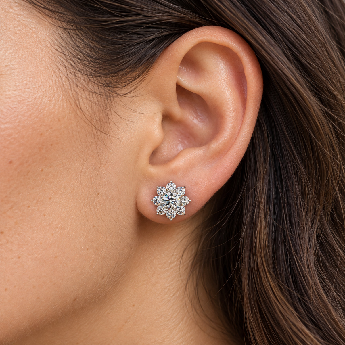 Floral lab-grown diamond stud earrings in sterling silver, worn on the ear, lifestyle photo