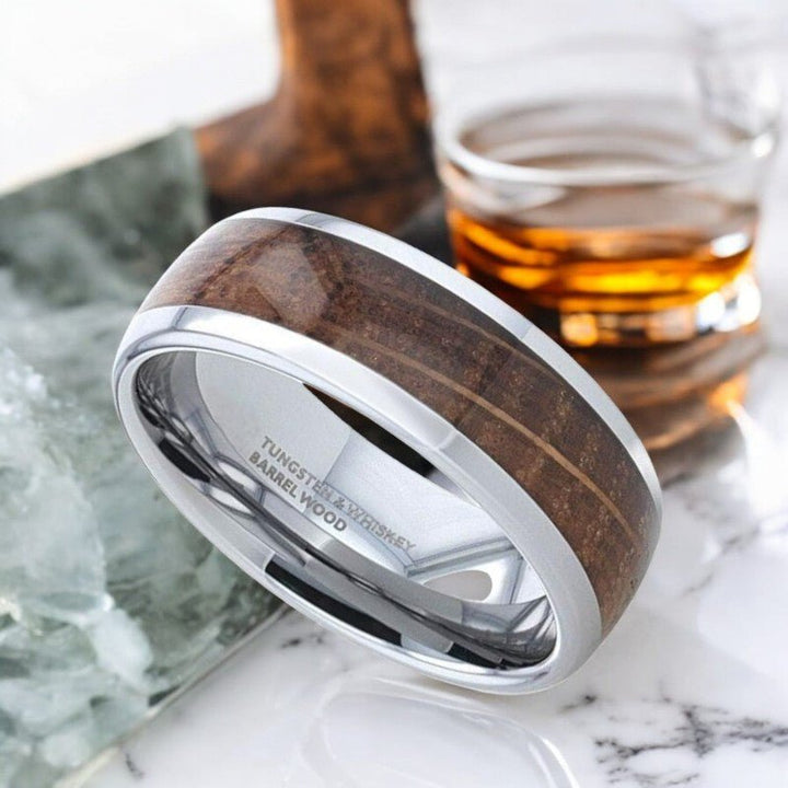 Side view of FORMENT tungsten ring featuring whiskey barrel inlay and domed polished edges.