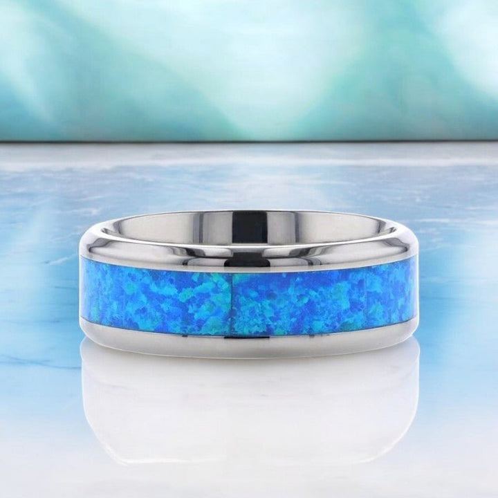 Unique titanium ring with blue-green opal inlay, polished beveled edges, and comfort-fit design - Aydins Jewelry.