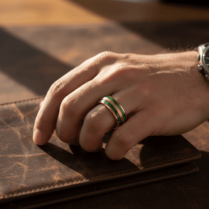 GARRISON — Lifestyle photo on hand — men's tungsten wedding ring.