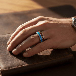 GENIE — Lifestyle photo on hand — men's tungsten wedding ring.