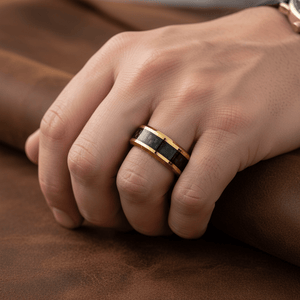 GILDWING — Lifestyle photo on hand — men's tungsten wedding ring.