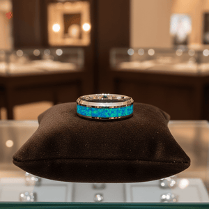 GLEAMING — Premium boutique display on velvet — men's tungsten wedding ring.