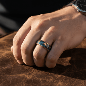 GLITSEA — Lifestyle photo on hand — men's tungsten wedding ring.
