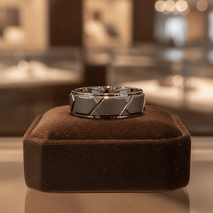 GRAPHIZOID — Premium boutique display on velvet — men's tungsten wedding ring.