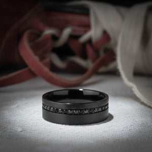 Aydins GROOVIX | Polished Black Tungsten Grooved Black CZ Wedding Ring 8mm lifestyle scene, boxing gym canvas