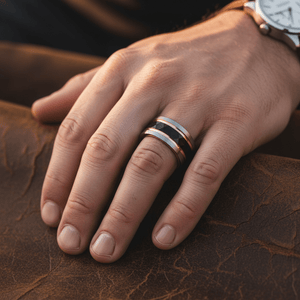 GUSTAVO — Lifestyle photo on hand — men's tungsten wedding ring.