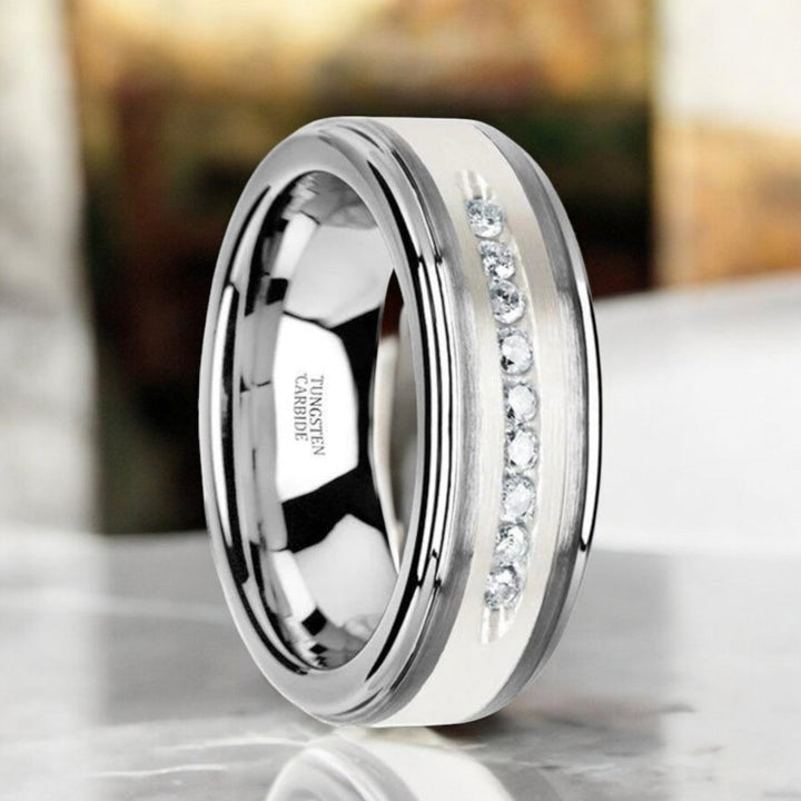 Silver tungsten ring with raised center, brushed inlay, and nine channel-set white diamonds, 8mm width - Aydins Jewelry.