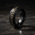 HERAKLES — Luxury 3/4 angle on dark marble — men's tungsten wedding ring.