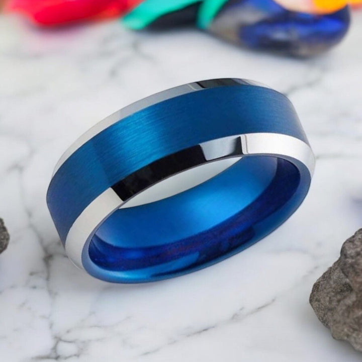 Side view of HYDRO Blue Tungsten Ring showing the polished silver beveled edges.