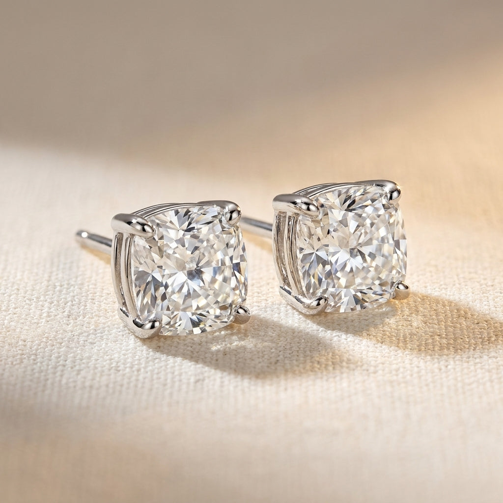 IGI certified lab-grown diamond stud earrings, cushion cut F+/VS+ 14k white gold, studio hero shot