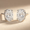 IGI certified lab-grown diamond stud earrings, oval F+/VS+ 14k white gold, studio hero shot
