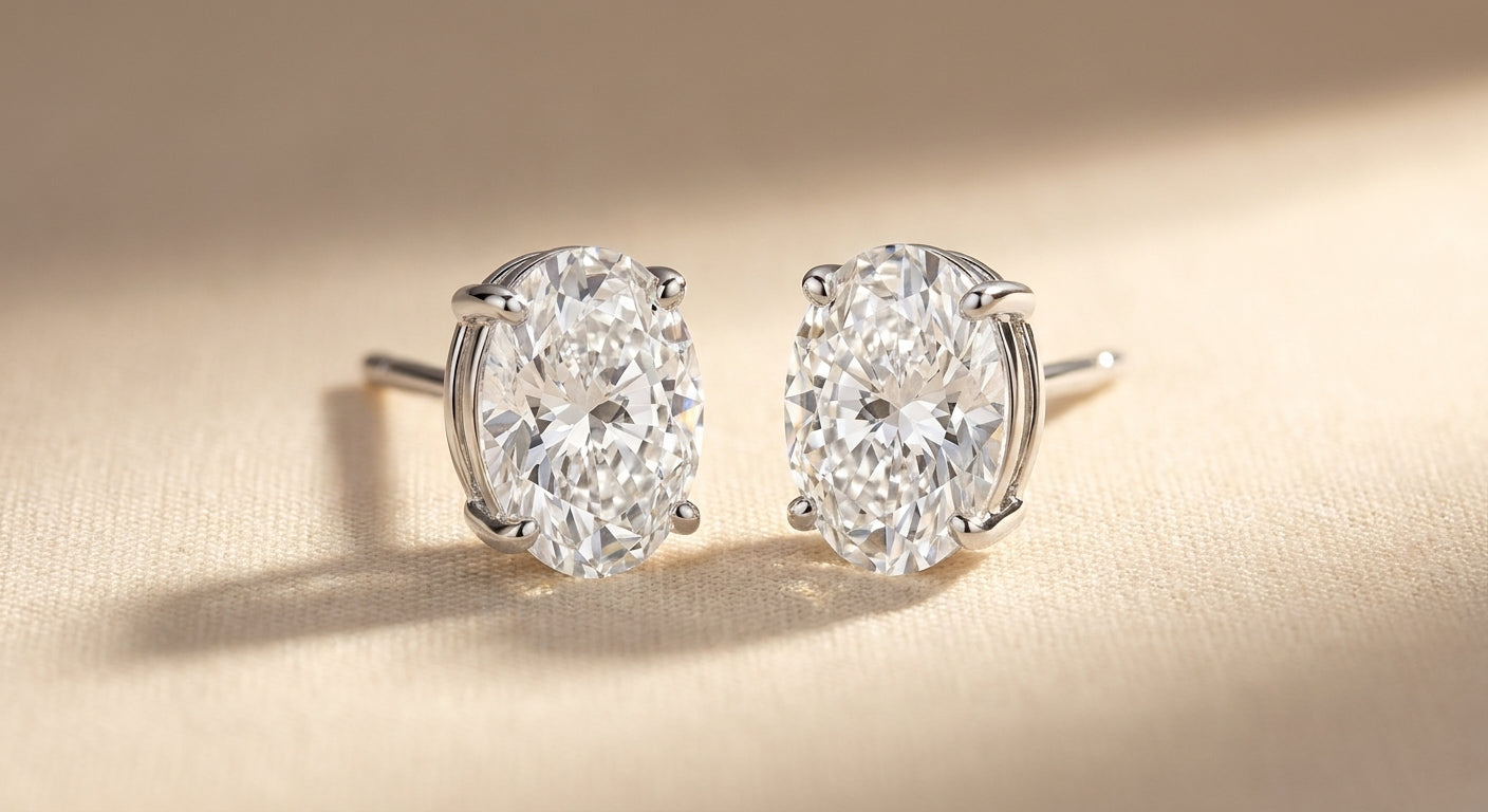 IGI certified lab-grown diamond stud earrings, oval F+/VS+ 14k white gold, studio hero shot