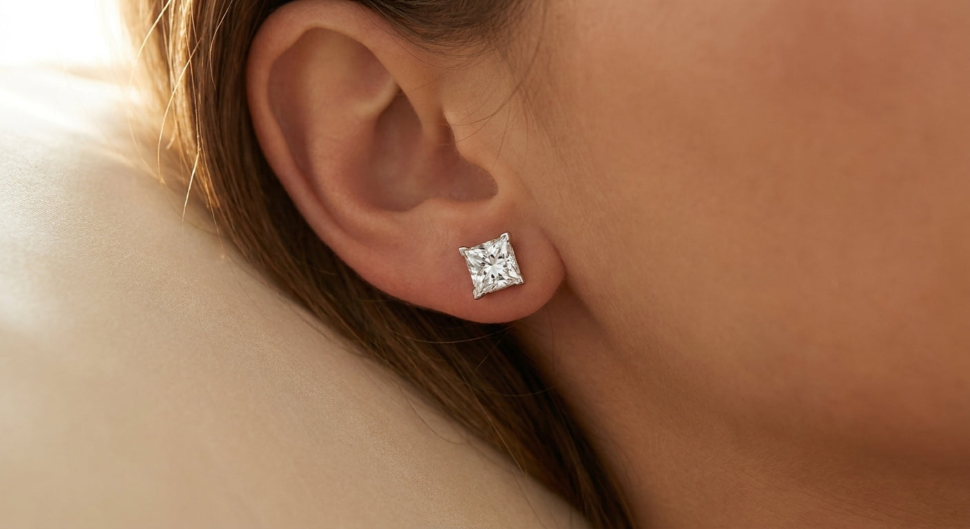 IGI certified lab-grown diamond stud earrings, princess cut F+/VS+ worn on earlobe, lifestyle photo