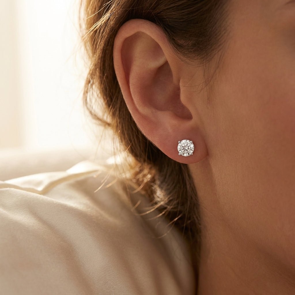 IGI certified lab-grown diamond stud earrings, round F+/VS+ worn on earlobe, lifestyle photo