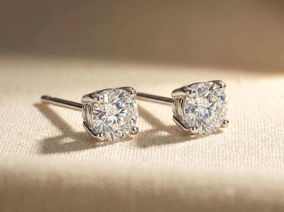 IGI certified lab-grown diamond stud earrings, round F+/VS+ 14k white gold, studio hero shot