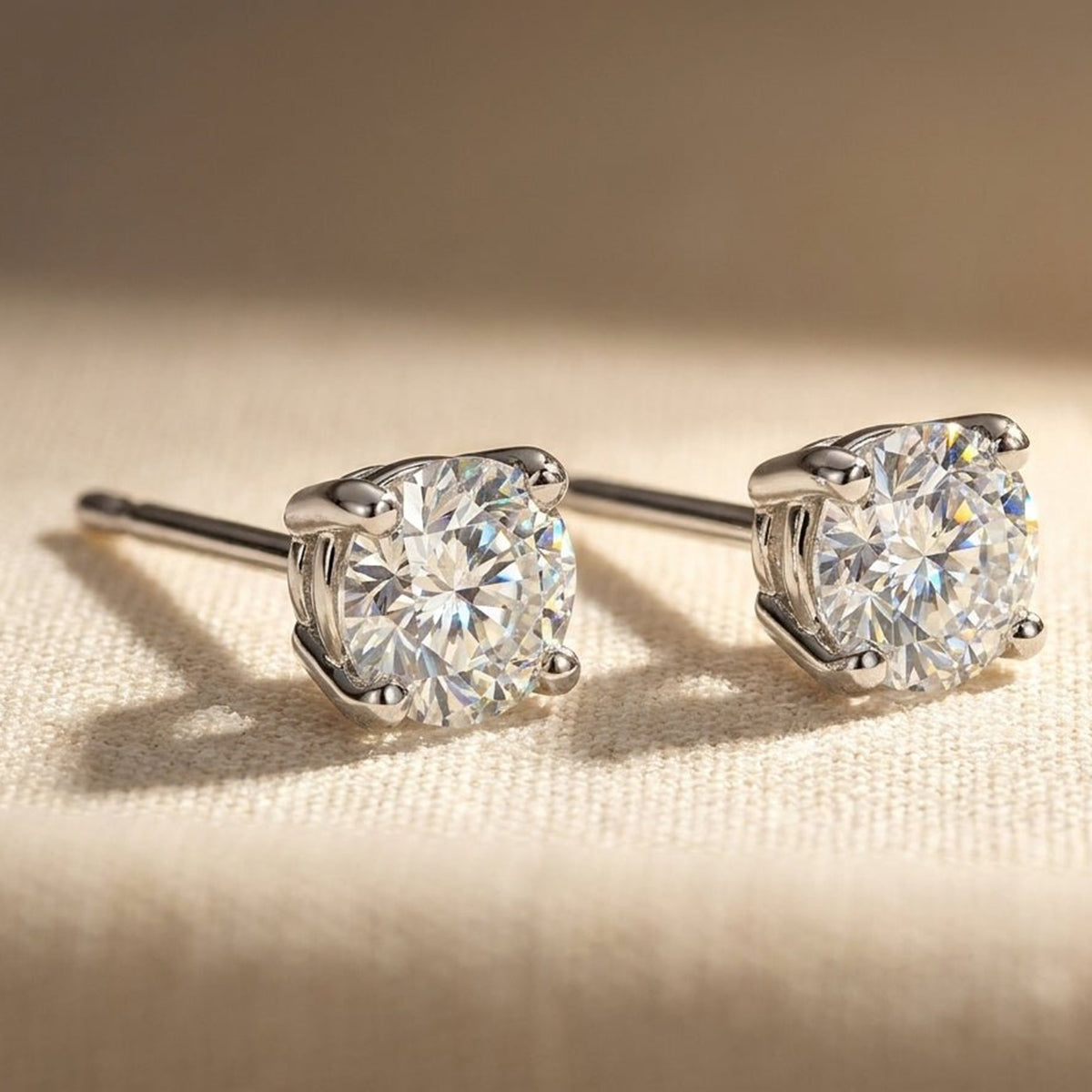 Round lab-grown diamond stud earrings, studio hero photo