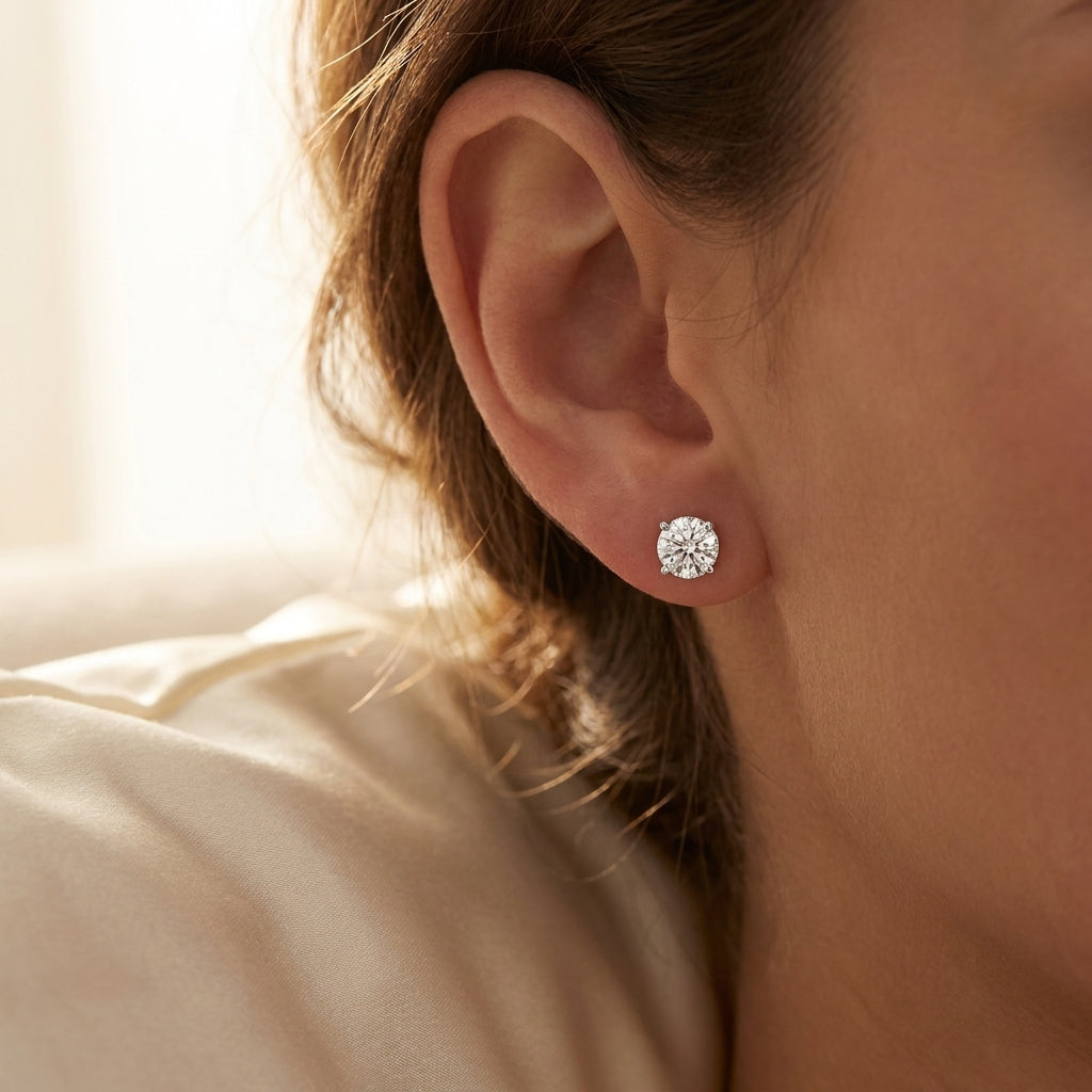 IGI certified lab-grown diamond stud earrings, round F+/VS+ worn on earlobe, lifestyle photo
