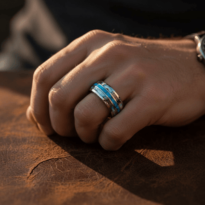 IRIDIAN — Lifestyle photo on hand — men's tungsten wedding ring.