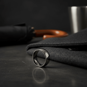 IVORY — Editorial masculine still life — men's tungsten wedding ring.
