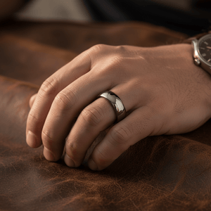 IVORY — Lifestyle photo on hand — men's tungsten wedding ring.