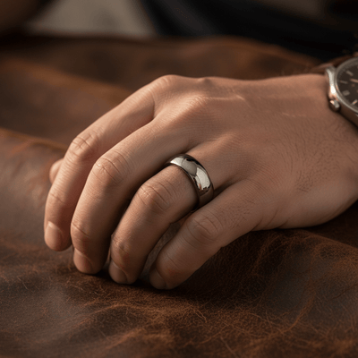 IVORY — Lifestyle photo on hand — men's tungsten wedding ring.