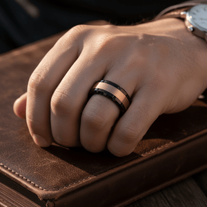 JOLT — Lifestyle photo on hand — men's tungsten wedding ring.