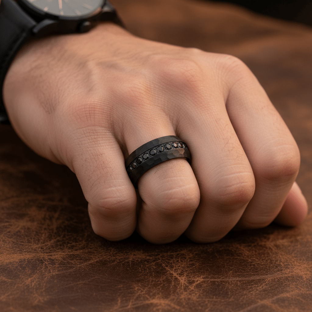 JUNCOS — Lifestyle photo on hand — men's tungsten wedding ring.