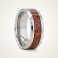 JURASSIC silver tungsten carbide ring with red dinosaur bone inlay running around the band and polished beveled edges, studio hero shot