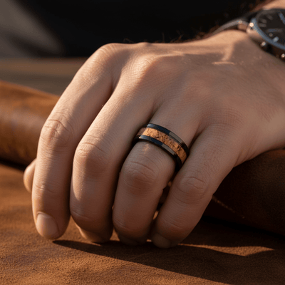 LANG — Lifestyle photo on hand — men's tungsten wedding ring.
