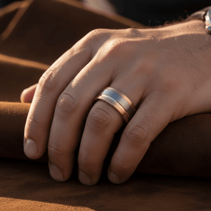 LEONEL — Lifestyle photo on hand — men's tungsten wedding ring.