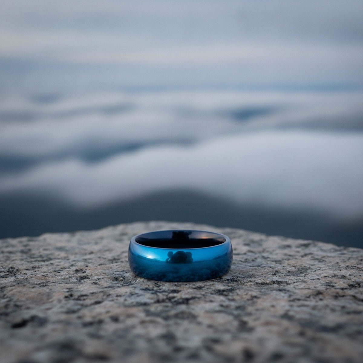 Aydins LIGHTNING | Blue Tungsten Carbide Wedding Ring with Domed Profile - 8mm lifestyle scene, granite overlook