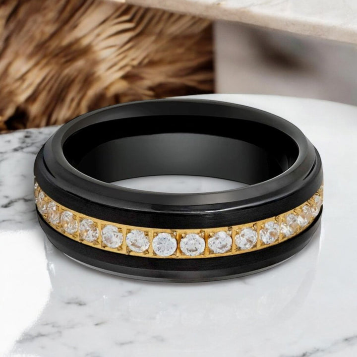 Close-up of LUSTRE 8mm Tungsten Ring with gold center and diamond accents.