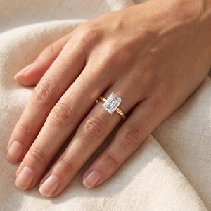 LYDIA emerald lab-grown diamond ring in 14K two-tone gold, worn on the hand, approx. 1 ct center