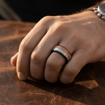 LYRIC — Lifestyle photo on hand — men's tungsten wedding ring.