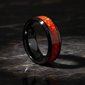 MAGICA — Luxury 3/4 angle on dark marble — men's tungsten wedding ring.