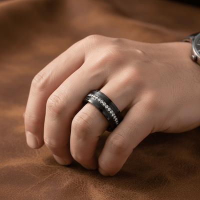 MAJESTIC — Lifestyle photo on hand — men's tungsten wedding ring.